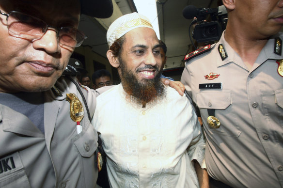 Umar Patek is escorted to court in Jakarta in 2011.