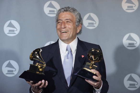 Tony Bennett displays his two Grammy’s backstage at the Shrine Auditorium in 1995.