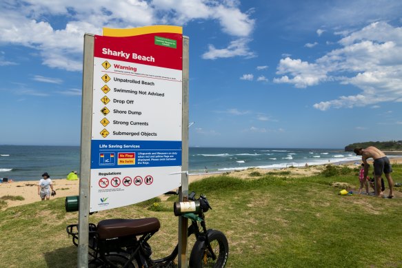 Sharky Beach has signs that warn the beach is dangerous and unpatrolled, but the popular dog-friendly beach is often packed with swimmers.  