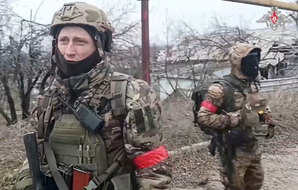 Two Russian soldiers in Avdiivka after Ukraine’s retreat from the town.