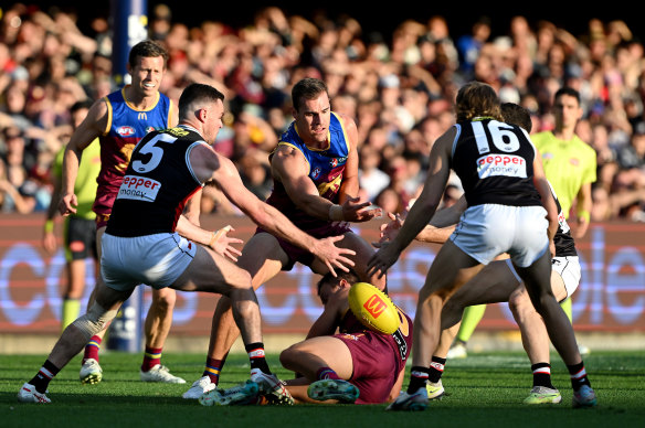 Jack Payne of the Lions and Brad Crouch of the Saints compete for the ball.
