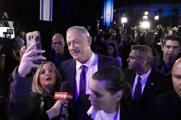Blue and White party leader Benny Gantz arrives at party headquarters in Tel Aviv after the March 2 election.
