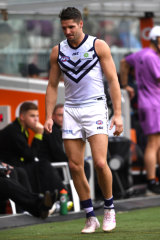 Fremantle's Jesse Hogan limps off the MCG on Saturday.