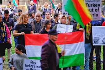 Protesters taking part in a Kurdish rally in front of the State Library in Melbourne on Saturday.