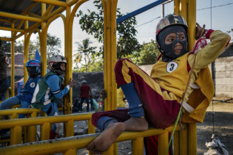 Riders await the start of a horse race in Bima, on the Indonesian island of Sumbawa, where child jockeys are a longstanding tradition.