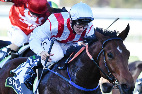 Ascot calling: Tim Clark guides Shoals to victory in the Robert Sangster Stakes.