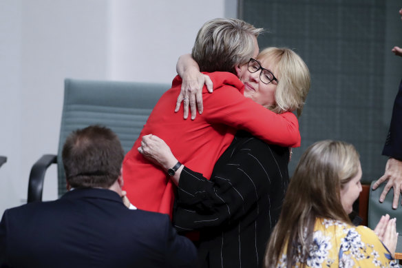 Jenny Macklin is congratulated by Deputy Opposition Leader Tanya Plibersek.