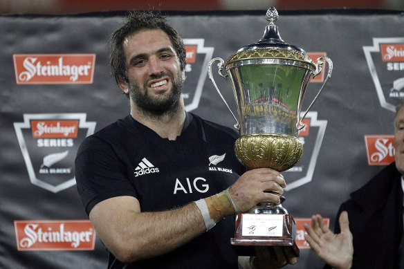 Sam Whitelock holds the Gallaher Trophy after beating France.