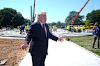 President Donald Trump speaks outside the White House, Wednesday, Aug. 19, 2026, in Washington, near the construction site of the new helicopter landing zone on the South Lawn of the White House.