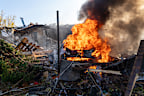 A car burns following a Russian strike on a residential neighbourhood in Kharkiv, Ukraine, on Sunday, October 11,