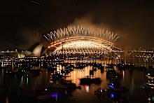 Golden fireworks spray from the Sydney Harbour Bridge.