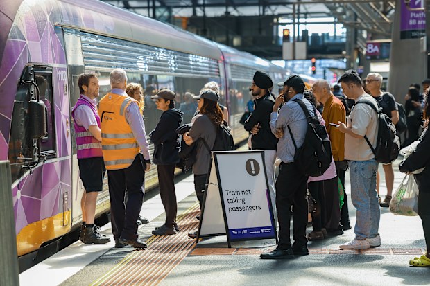 People queue for the V Line at Southern Cross station in Melbourne after Victoria introduced free public transport for all users.