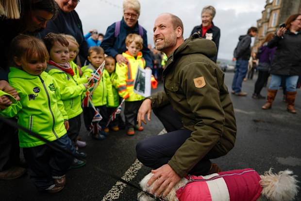 Prince William, Prince of Wales, meets members of the public outside, after visiting the community-owned Anchor Tavern Pub & Hub