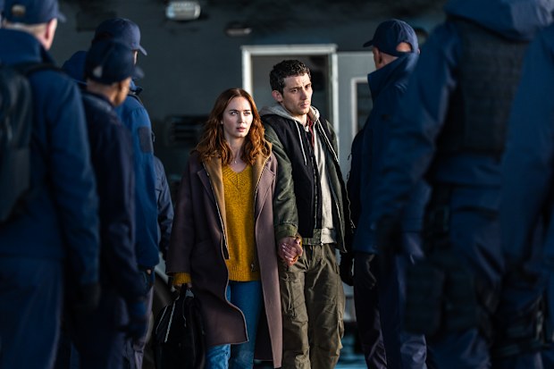 Center L to R: Emily Blunt and Josh O'Connor in DISCLOSURE DAY, directed by Steven Spielberg.