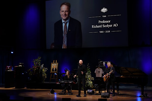 Peter Garrett AO, Martin Rotsey and Freyja Garbett perform at the State Memorial Service for Professor Richard Scolyer AO at the Opera House in Sydney.
