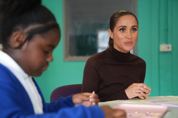 Meghan, Duchess of Sussex, joins a jewelry making session during a visit to The Community Recording Studio in Nottingham, England, Thursday,