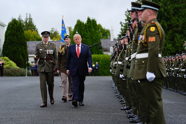 U.S. President Donald Trump reviews soldiers from the Guard of Honor during a visit with Ireland’s President Catherine Connolly at Áras an Uachtaráin in Dublin
