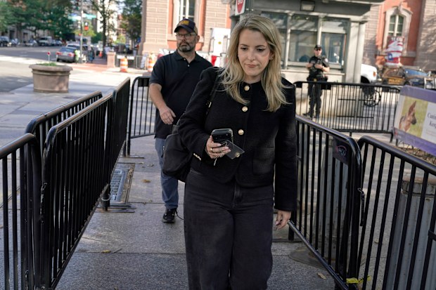 CNN Senior White House Reporter Betsy Klein, carrying an empty credential holder after having her credential revoked