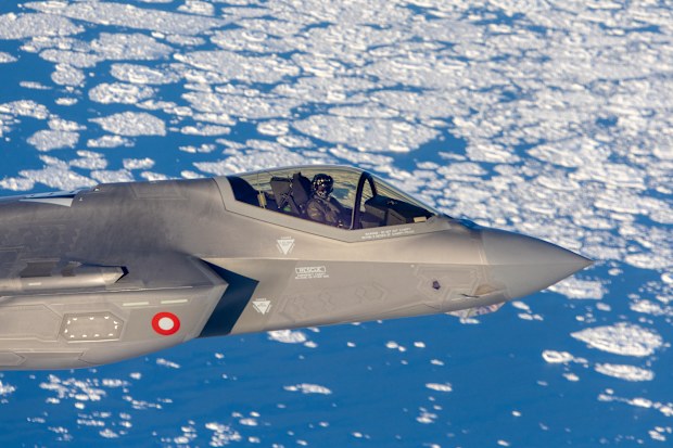 A Danish Air Force F-35 aircraft patrols over the east coast of Greenland.