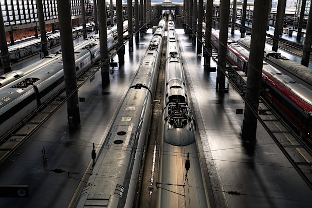 High-speed trains are photographed on their platforms at Madrid’s Atocha station, Spain