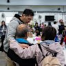 Residents rest at a temporary shelter after a fire broke out at Wang Fuk Court, a residential estate in the Tai Po district of Hong Kong’s New Territories.