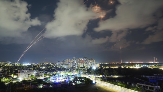Rockets from the Israeli Iron Dome air defence system manoeuvre to intercept a rocket fired from the Gaza Strip, in Ashkelon, Israel.