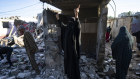 Palestinians inspect destruction after an Israeli strike in Rafah, southern Gaza. 
