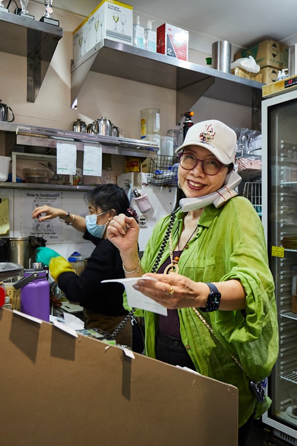 Annie So taking orders at Canton Noodle House.