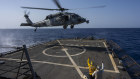 An HSC-7 helicopter lands on the Arleigh Burke-class guided missile destroyer USS Laboon in the Red Sea last week. 