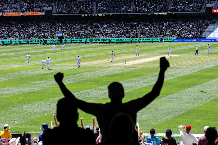 England supporters celebrate as Australia lose a wicket at the MCG on Boxing Day.