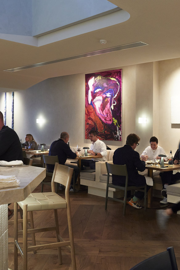 The dining room is filled with unique art pieces. 
