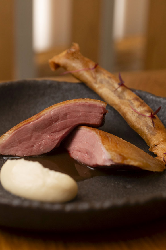 Aged duck breast with a spring roll filled with confit duck leg.