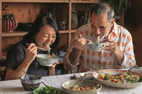 Helen Goh and Yotam Ottolenghi sharing dishes from the cookbook Comfort.