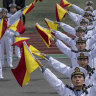 Chinese sailors perform signals with flags at the PLA Navy’s Submarine Academy to mark the navy’s 75th anniversary  in Qingdao, China, on April 21.