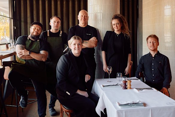 Ian Curley (centre, back) with some of his staff.