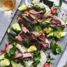 Grilled steak and vermicelli salad with spicy dressing and smashed cucumbers