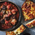 Serve these oven-baked meatballs with cheesy garlic bread.