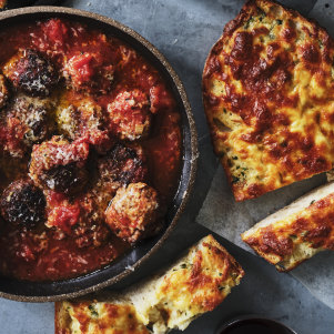 Serve these oven-baked meatballs with cheesy garlic bread.