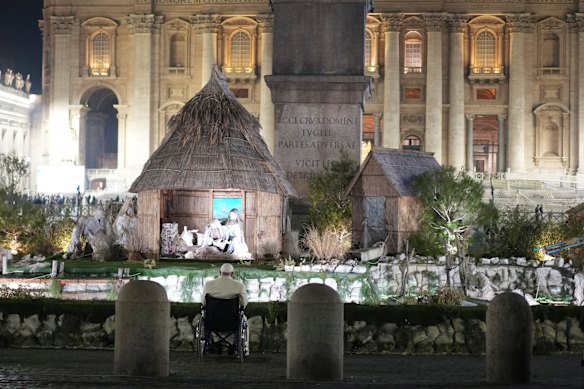 Pope Francis stops for a moment of prayer in front of the nativity scene that adorns St Peter’s Square at the Vatican.
