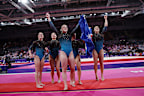 Emily Whitehead holds the flag in front of her teammates.