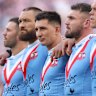 Victor Radley, centre, during the Last Post before the 2023 Anzac Day clash.