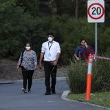 Workers leave Anglicare's Newmarch House on May 5. Millard says his staff had cared for residents with ''tremendous compassion”.
