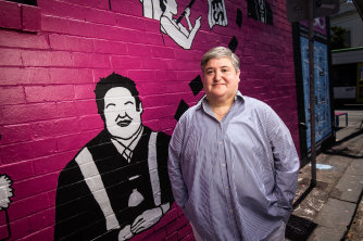 Cr Tony Briffa with the mural painted in Fitzroy to celebrate Victoria’s LGBTQI+ history. 