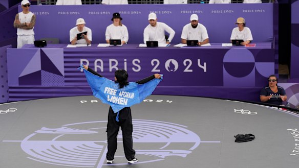 Manizha Talash, known as Talash, wears a cape which reads ‘Free Afghan Women’ as she competes in Paris.