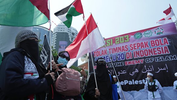 Protesters wave Palestinian flags as they marched in Jakarta last week against Israel’s participation in the Under-20 FIFA World Cup.