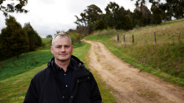 Climate 200 founder Simon Holmes a Court, pictured on his Victorian farm, warns a donations cap may thwart independents.