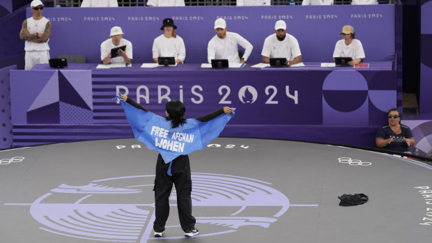 Manizha Talash, known as Talash, wears a cape which reads ‘Free Afghan Women’ as she competes in Paris.