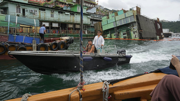 A kitchen section of Jumbo sinks, back right, on Monday, before the restaurant’s main building was towed away.