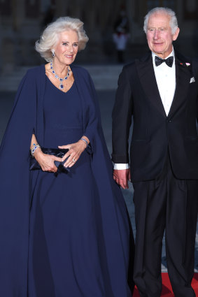 Queen Camilla in Dior and King Charles at Versailles.