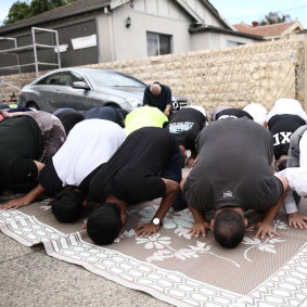 People undertake Friday prayers at Lakemba Mosque in Sydney.